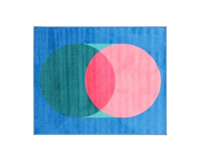 Alfombra geométrica abstracta con círculos azules, rosas y verdes